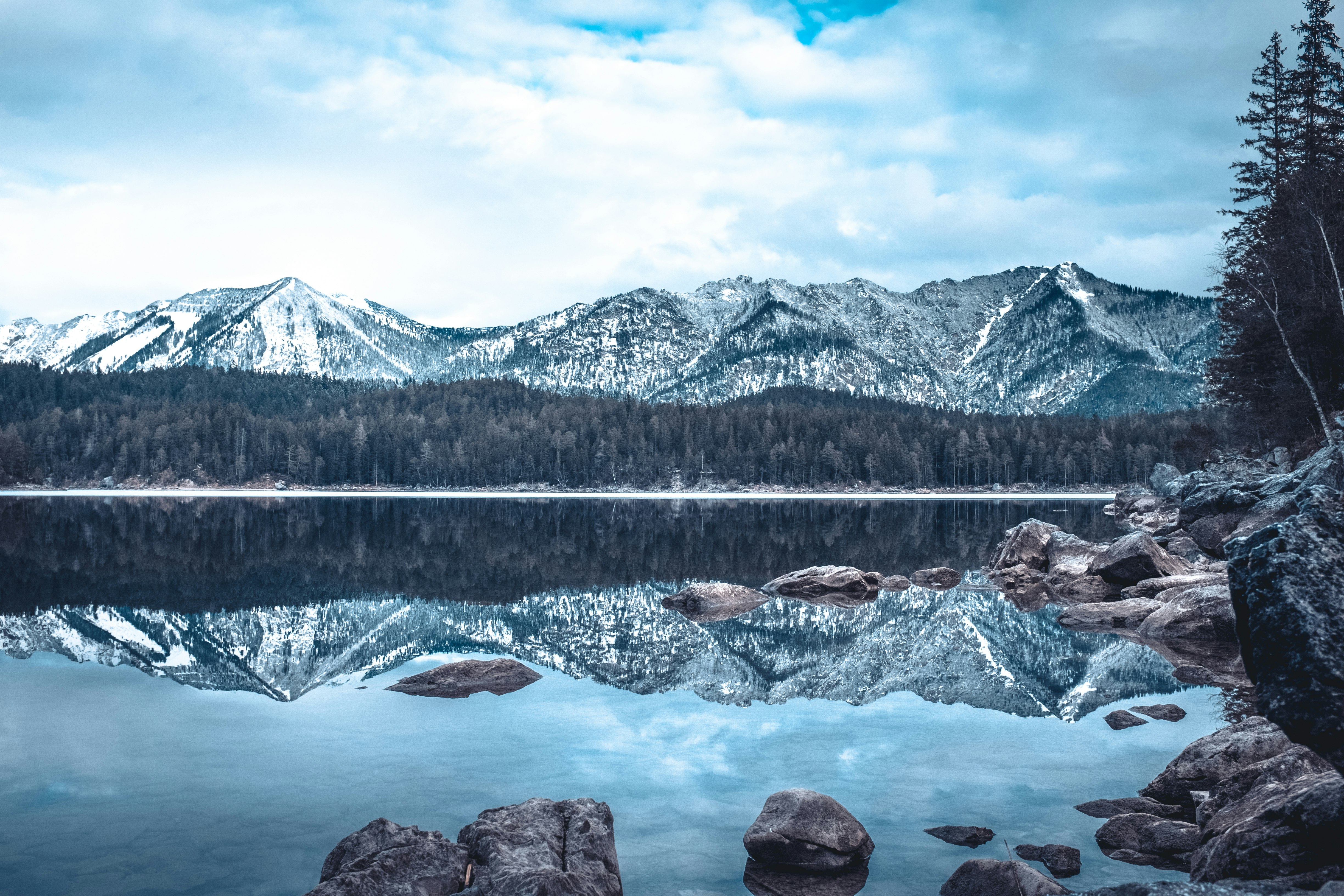 skyline photography of mountain and water